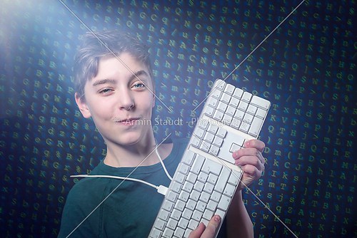 smiling teenage boy with computer keyboard and letters salad as 