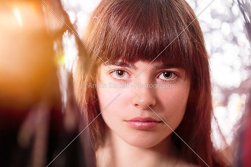 portrait of a beautiful teenage girl, with light leak and bokeh