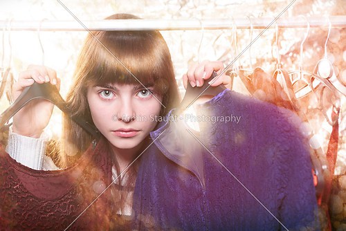 beautiful teenage girl and her wardrobe in backlit