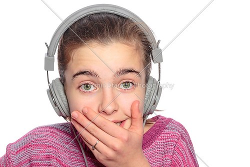 funny taken aback teenage girl with headphones