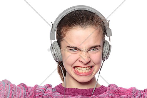 enthusiastic teenage girl with headphones, isolated on white