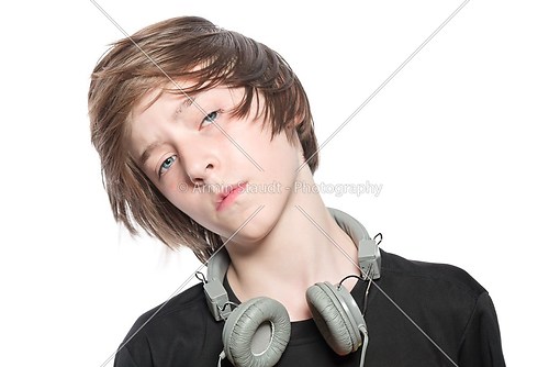 moving cool teenager boy with headphones, isolated on white