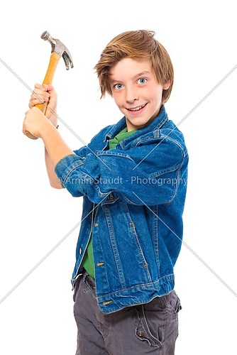 lunatic teenage boy holding a hammer ready to hit, isolated on w