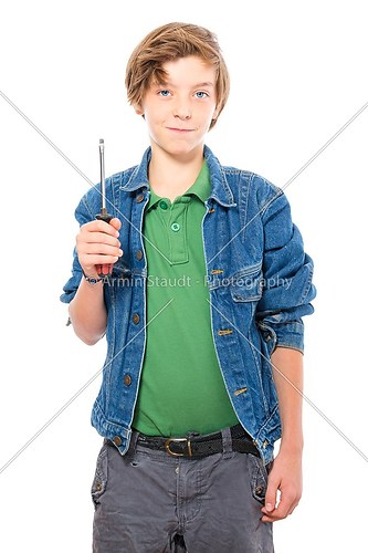 confident teenage boy holding a screwdriver, isolated on white