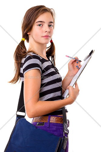 teenage girl writing on a clipboard, isolated on white
