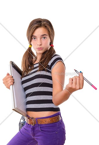 teenage girl with clipboard and pencil looking cool into camera,