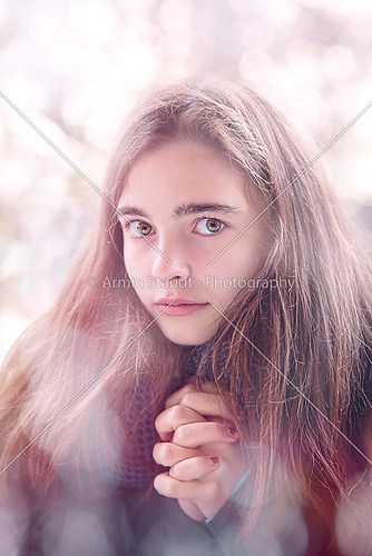 portrait of a beautiful teenage girl praying