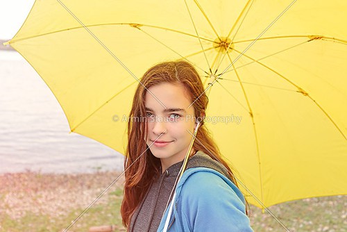 portrait of a beautiful woman with yellow umbrella