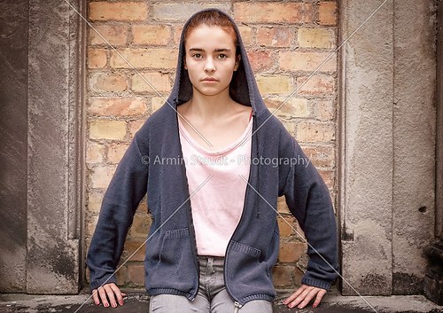 maria like portrait of a sitting teenager girl in front of an ol