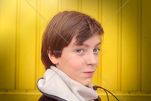 portrait of a smiling teenage boy with winter scarf