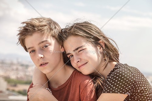 sister hugging her brother, toned image