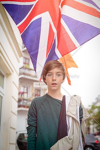 outdoor shot of a teenager boy in front of the british union jac