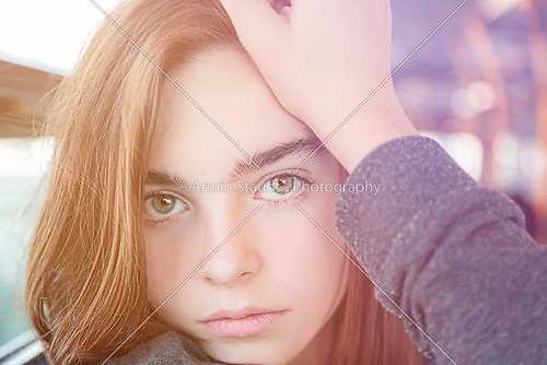 portrait of a beautiful teenager girl, sitting in a bus