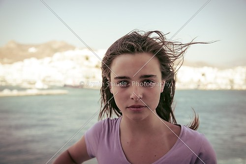 female teenager standing on a ship 