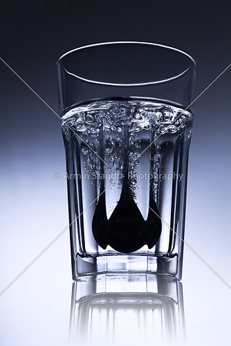 simple water-glass with spoon and bubbles