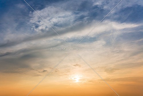 sunset with clouds and blue sky