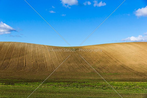 Plowed field on clear hills