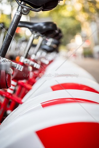 perspective row of bikes, red and white
