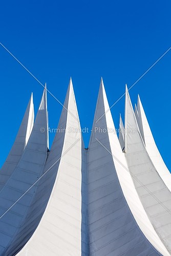 white futuristic roof with spikes, isolated on blue sky