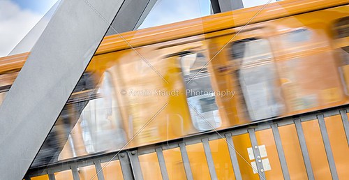 double exposure of a moving berlin subway on a bridge