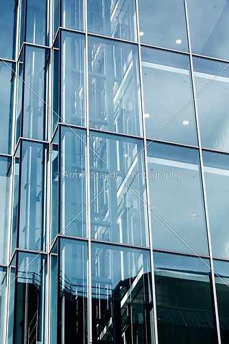 detail of a modern glass facade of an office building
