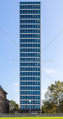 symmetrical front shoot of an office building with blue sky from