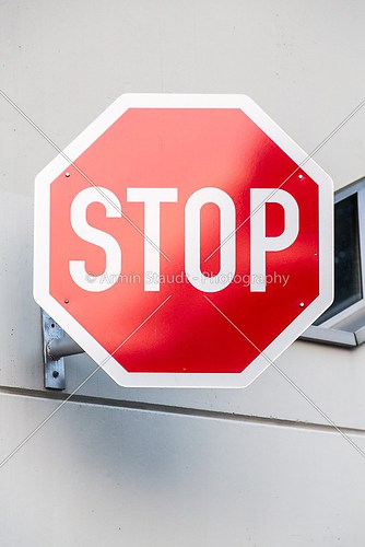 german stop sign on a concrete wall