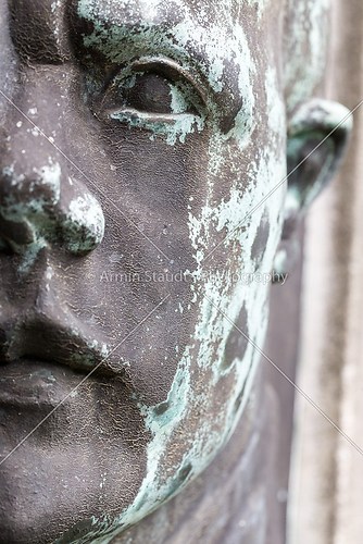 old weathered bronze portrait of a man