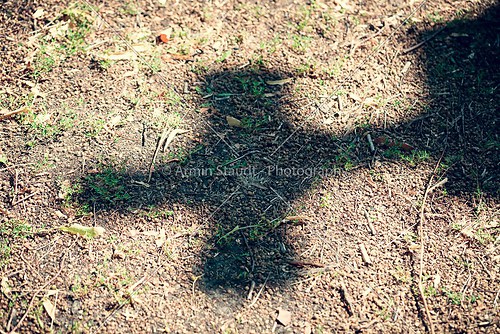 shadow of a cross on dirty floor
