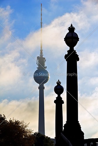 berlin television tower with two similar pillars of a bridge