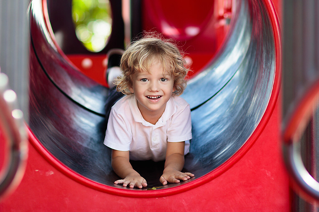 Kind auf Spielplatz | Child playing on outdoor playground. Kids play on school or kindergarten yard. Active kid on... | playground, children, kids, slide, happy, playing, fun, kid, summer, childhood, park, play, outside, school, child, boy, girl, outdoors, active, little, outdoor, swing, climb, colorful, yellow, purple, blond, recreation, young, people, cute, cheerful, activity, playful, leisure, preschool, yard, kindergarten, toddler, baby, funny, laughing, small, happiness, spring, joy, action, daycare, care, day