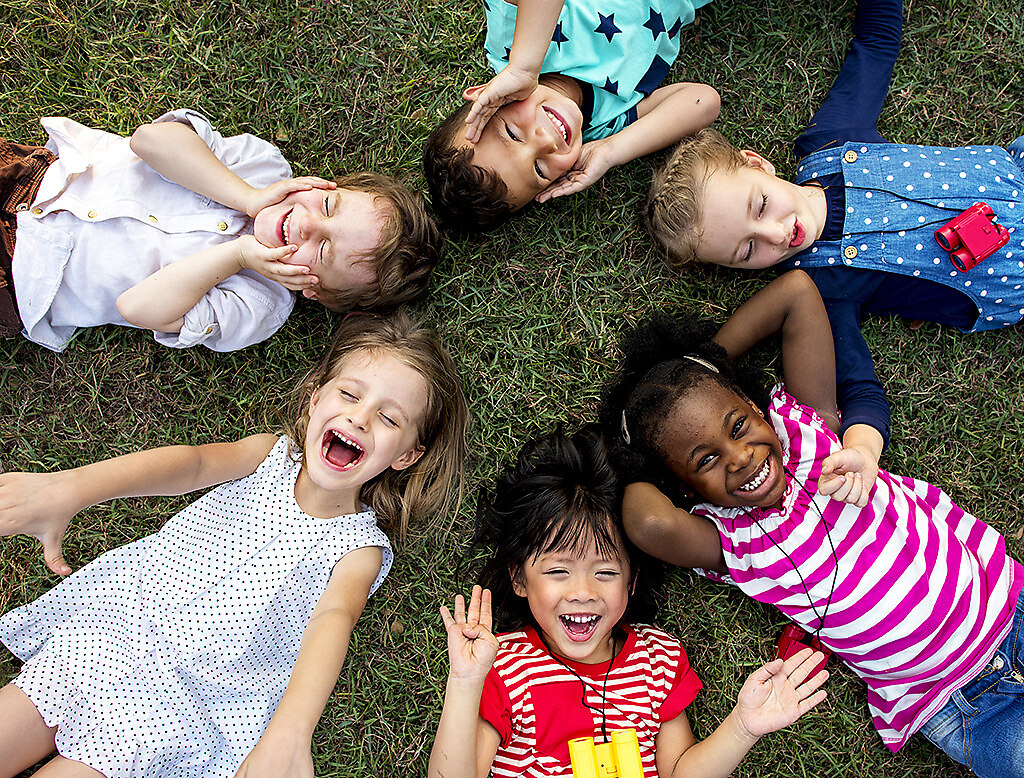 Group of kindergarten kids lying on the grass at park and relax  (Kita5) | Group of kindergarten kids lying on the grass at park and relax with smiling | person, relax, diverse, people, friends, primary, friendship, childhood, cheerful, smiling, schoolgirl, little girl, lying, grass, hobby, leisure, happiness, fun, team, holiday, vacation, little boy, outdoors, buddies, adorable, development, schoolboy, children, circle, education, child, playing, laughing, girl, casual, activity, offspring, playground, diversity, park, group of people, togetherness, classmates, young, kindergarten, ethnicity, boy, elementary, kids